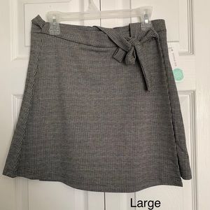Cross front skirt